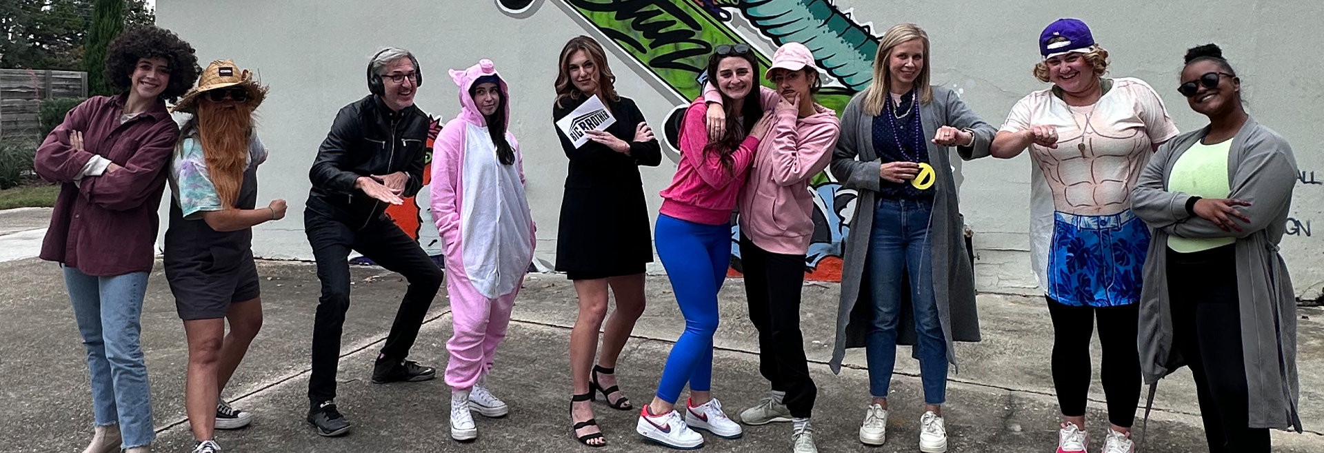 A group of STUN employees in the parking lot of STUN dressed up like Big Brother characters. The guy in the photo is the coolest.